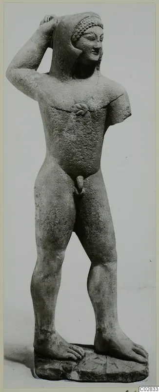Limestone statue of a standing nude male figure, one hand raised to its head, from Kition