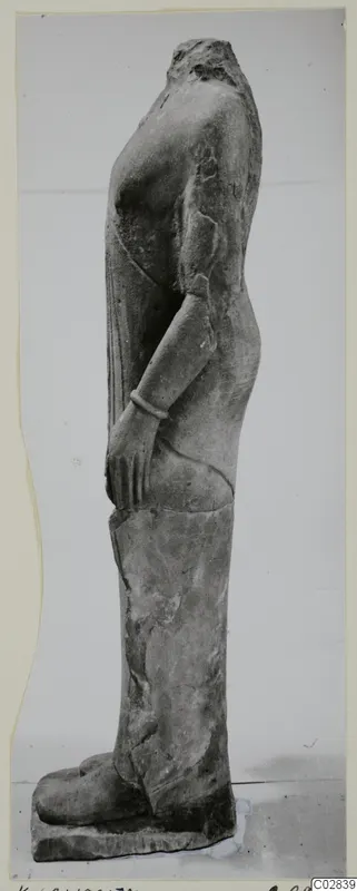 Headless limestone statue of a standing figure, shown in side profile, from Kition