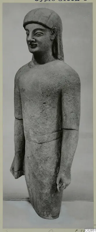Limestone statue of a standing figure with a cap-like headdress and arms at its sides, from Kition