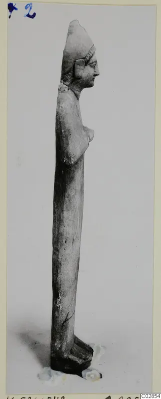 Limestone statue of a standing figure in profile, from Kition
