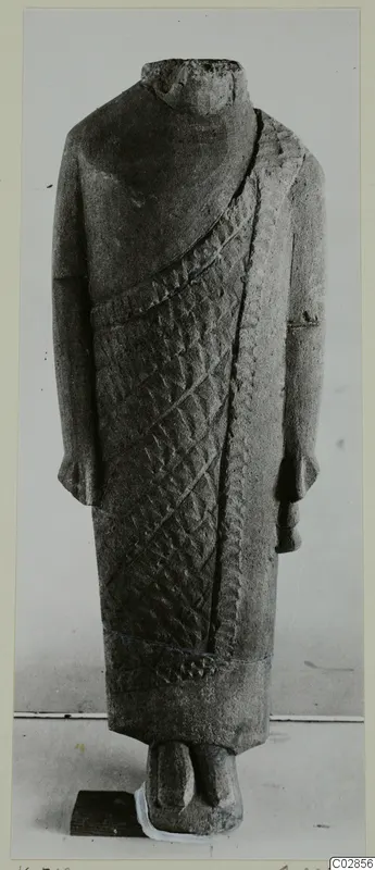 Headless limestone statue from Kition in a long garment with diagonal bands of incised pattern