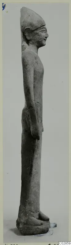Limestone statuette of a standing male figure in side profile, facing right, from Kition.