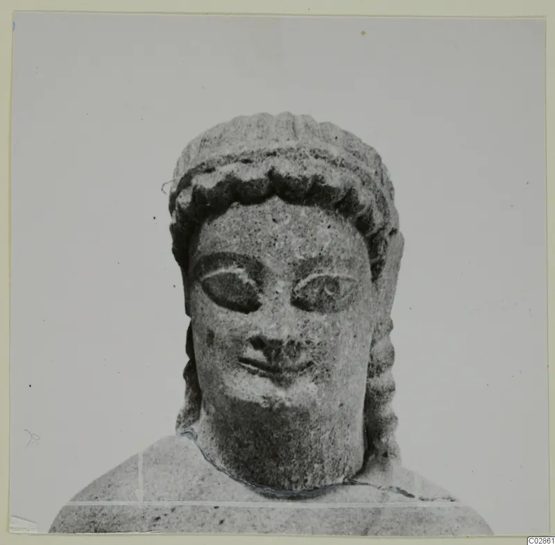 Limestone sculpture of a head and shoulders from Kition, seen from the front