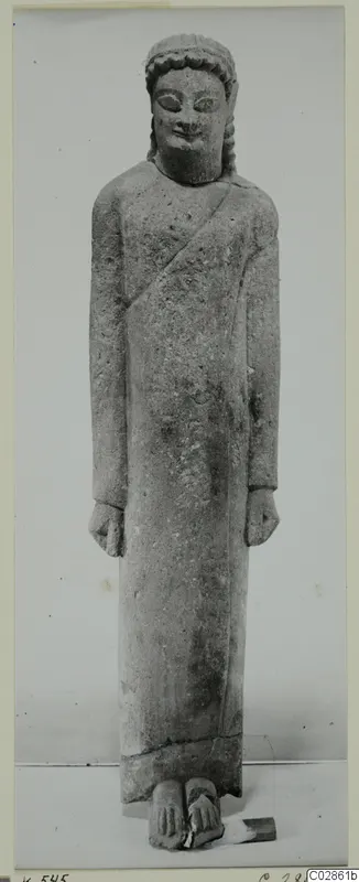 Limestone Cypro-Greek I statue of a standing figure in a long garment, Kition