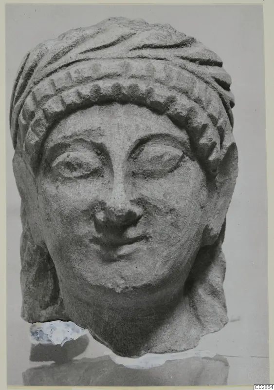 Limestone head with a patterned headdress, from Kition