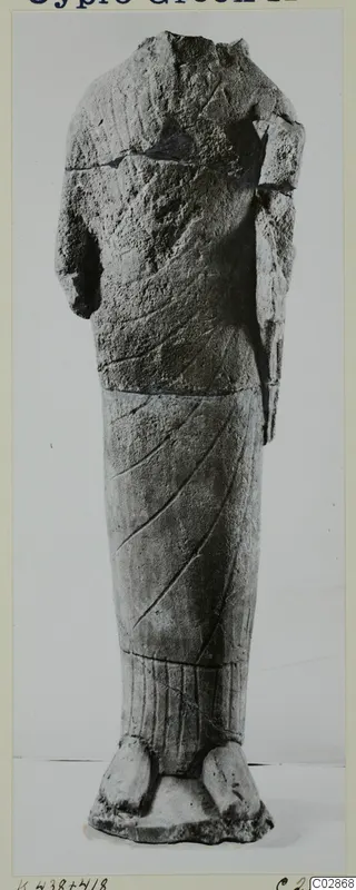 Headless limestone statue of a standing figure in a long garment, from Kition