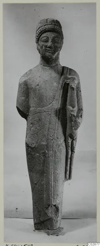 Limestone statue of a standing bearded figure from Kition, seen from the front