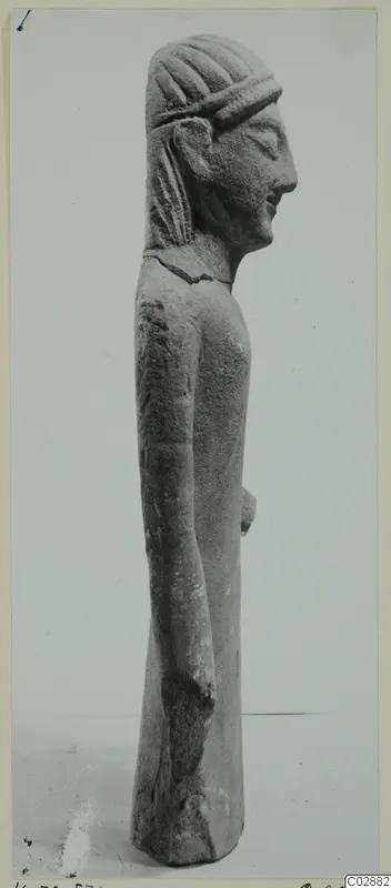 Limestone statuette from Kition, a standing figure seen in side profile with a banded hairstyle