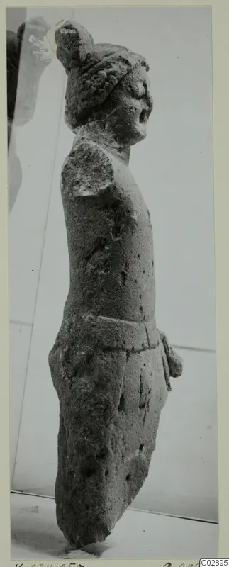 Limestone statuette of a standing figure from Kition, seen in side view