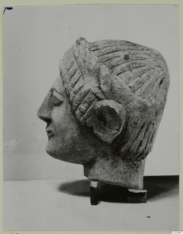Limestone sculpture of a head in profile facing left, from Kition