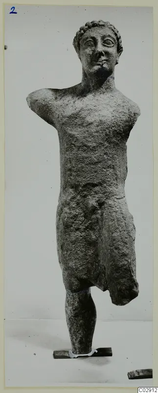 Limestone Cypro-Greek II statue of a standing nude male figure, from Kition
