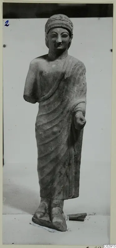 Limestone statue of a standing figure in a long draped garment, from Kition