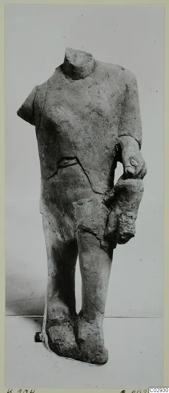 Headless limestone statue of a standing figure with one arm bent across the body, from Kition