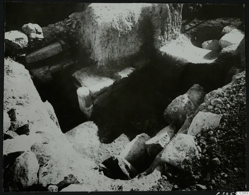 Excavation at Amathus showing a wall and scattered stones