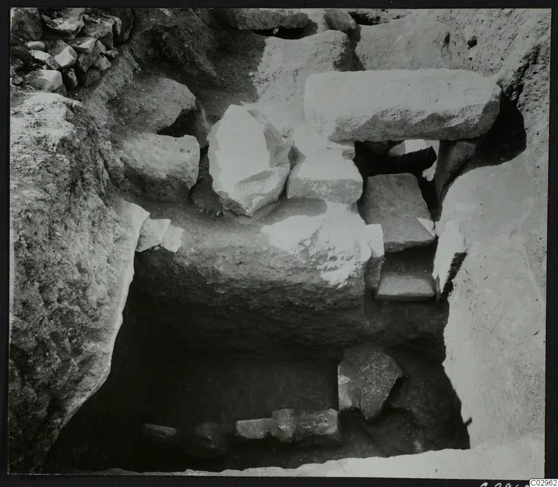 Excavation at Amathus showing a stone construction of large cut blocks and slabs set in a trench