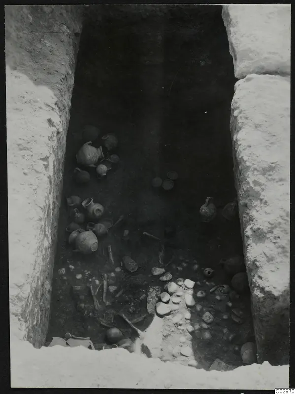 Tomb 10 at Amathus seen from above, with pottery vessels and bones lying in situ on the floor