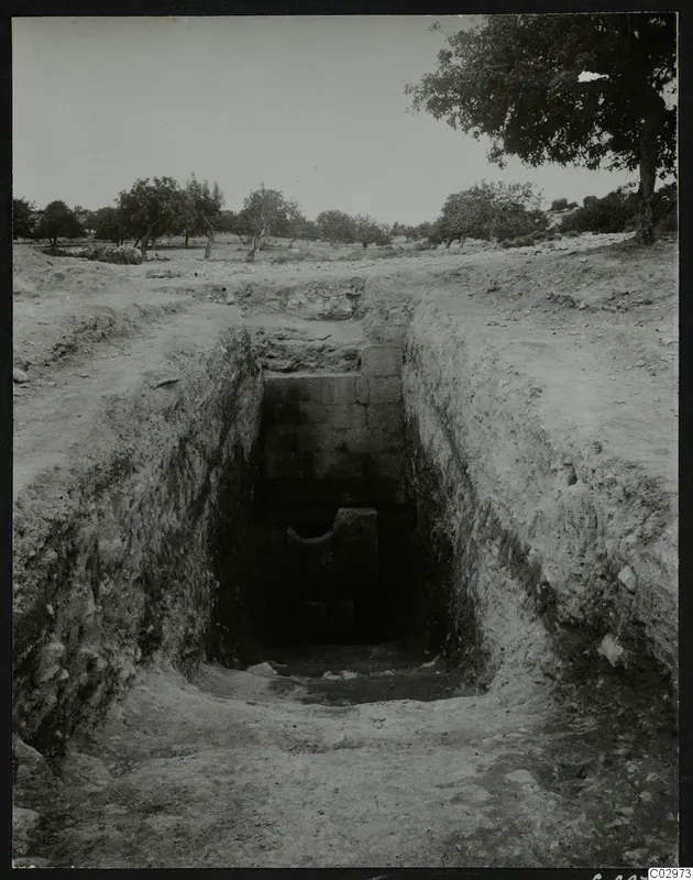 Tomb 2 at Amathus: dromos before opening, a cut passage leading to a stone-walled tomb entrance