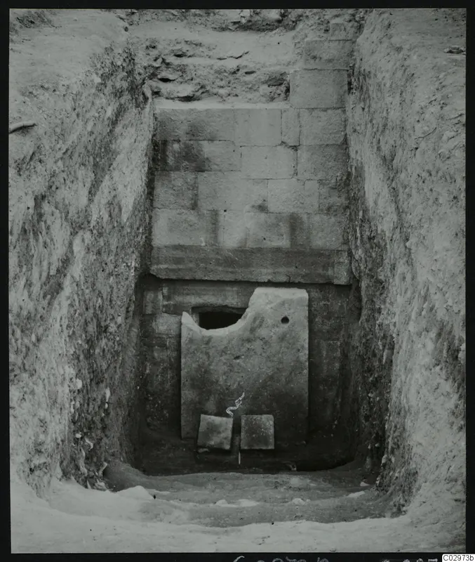Dromos of Tomb 2 at Amathus, with a large stone slab closing the doorway, before opening