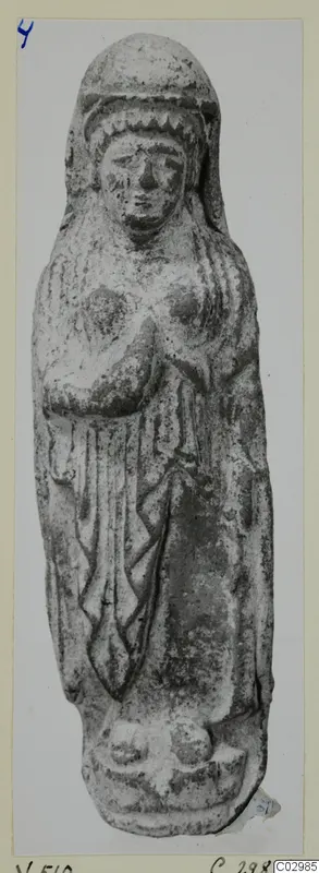 Standing figurine with a veiled head and hands folded at the chest, from Vouni