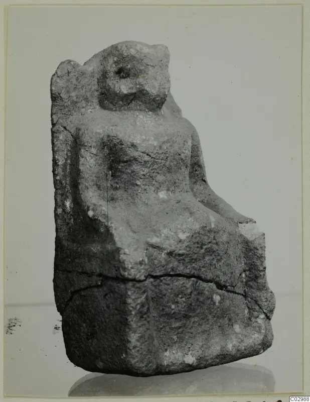 Limestone sculpture of a seated figure on a high-backed chair, from Vouni