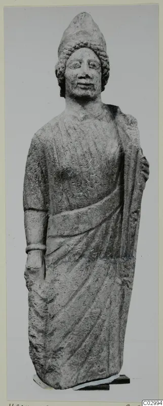 Limestone statue of a standing figure in a tall headdress with a draped garment, from Vouni