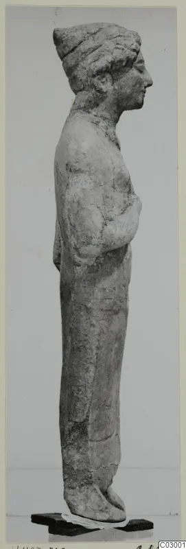Limestone statue from Vouni, a standing figure shown in profile facing right