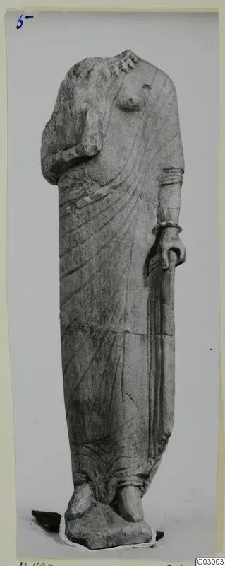 Limestone statue of a standing draped female figure from Vouni, head missing