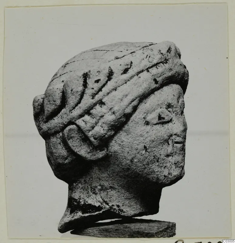 Stone head in profile facing right, with a banded headdress, from Vouni