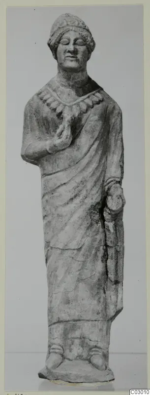 Limestone statue of a standing figure from Vouni, wearing a cap-like headdress and a necklace