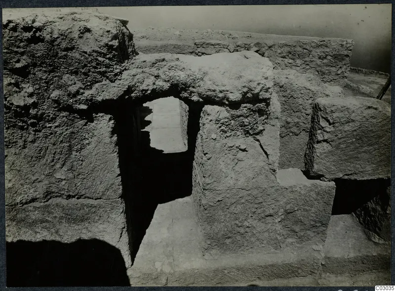 Large cut stone blocks and a narrow opening during excavation at the palace at Vouni
