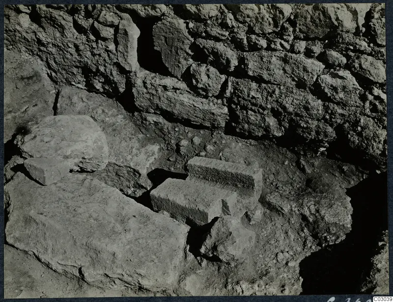 Excavated stone walls and loose blocks at the palace at Vouni
