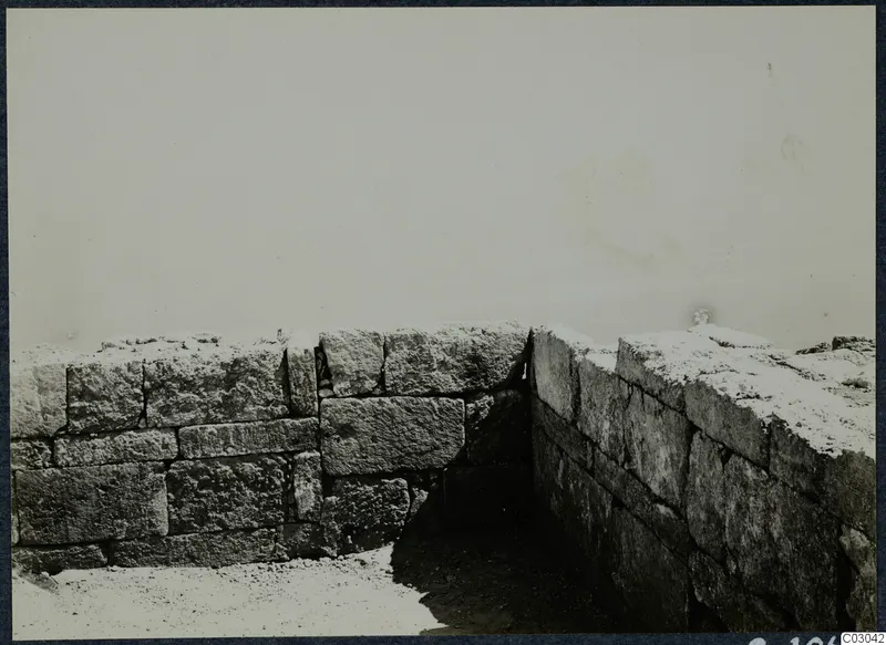 Corner of two excavated stone walls built of large rectangular blocks at the palace at Vouni