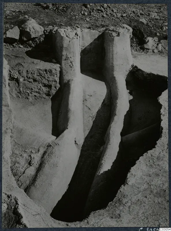 Excavation trench with pale walls and scattered stones at the palace at Vouni