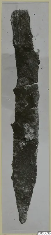 Corroded iron knife with a long pointed blade, find from Marion