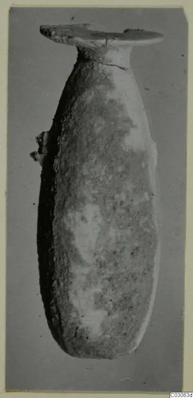 Alabaster vase from Cyprus with a long body, narrow neck and flat, disc-shaped mouth.