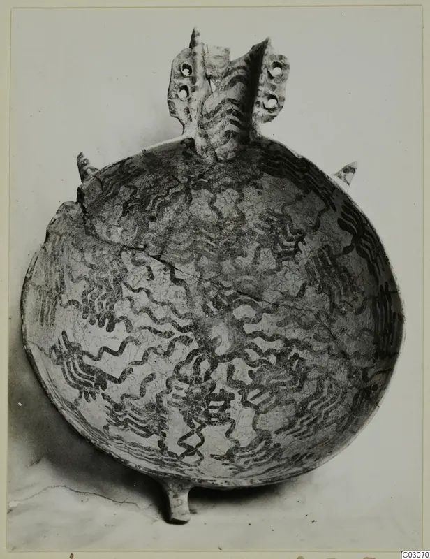White Painted IV-V bowl from Ayios Iakovos with dark wavy painted decoration and a pierced lug handle