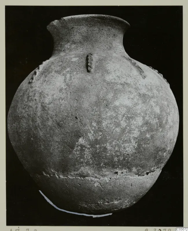 Hand-made pottery jar from Ayios Iakovos with a narrow flaring neck and a round body