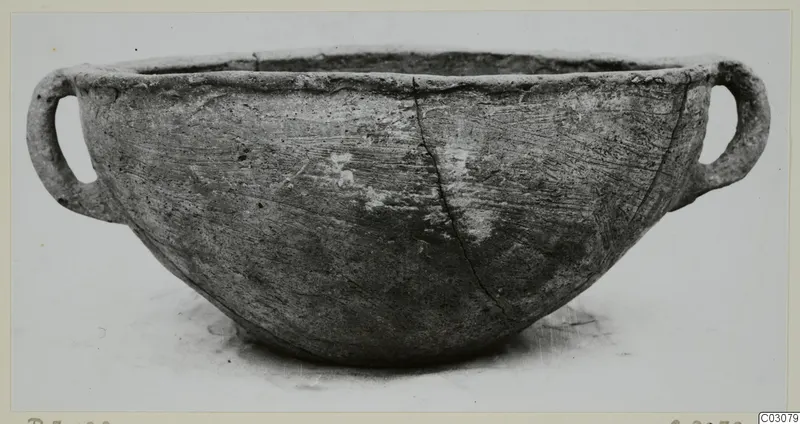 Pottery Plain White Hand-made Ware bowl with two loop handles, photographed alone