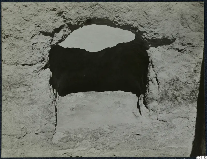 Rough pale stone wall with a rectangular opening at the palace at Vouni