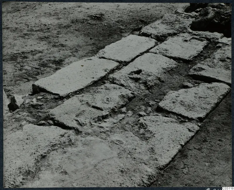 Excavated stone slabs forming a paved floor during excavation at the palace at Vouni