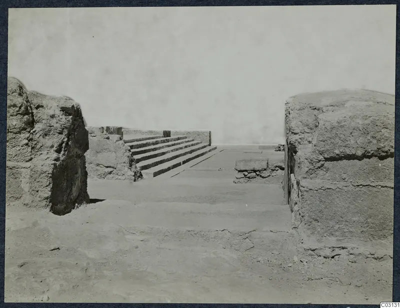 Ruined stone walls and a flight of stone steps at the palace at Vouni, seen from a low viewpoint.