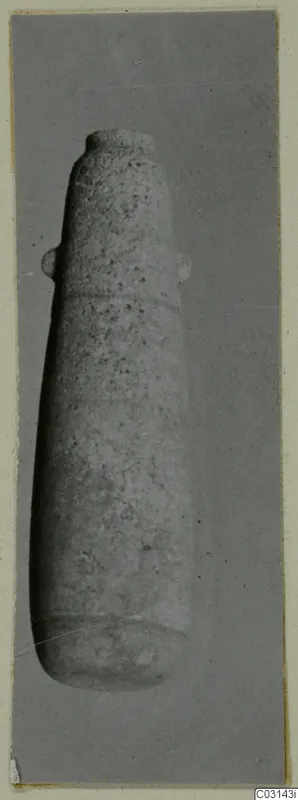 Tall alabaster vessel with a short neck and two small lugs on the upper body
