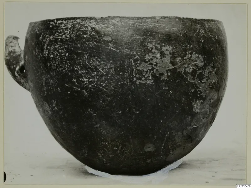 Pottery Red Polished III bowl from Lapithos, seen from the side, with a small handle on the left