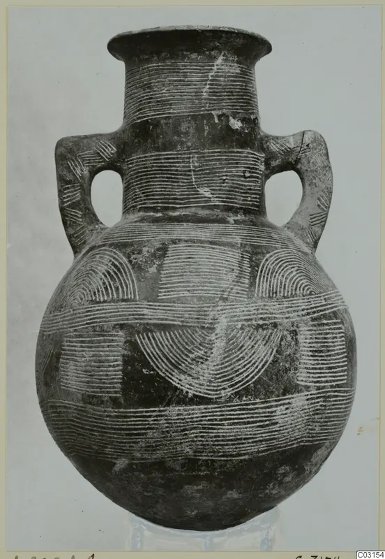 Pottery amphora with two handles and white incised linear decoration of bands and arcs.