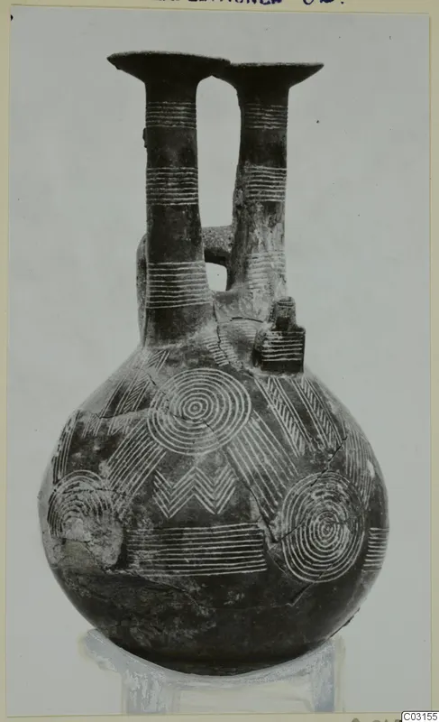 Pottery jug with two tall necks and concentric circle and chevron decoration, from Lapithos