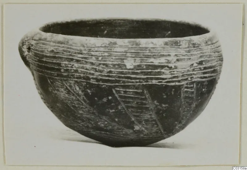Pottery bowl with a small lug, incised horizontal and diagonal lines, from the Vrysi tou Barba tombs at Lapithos