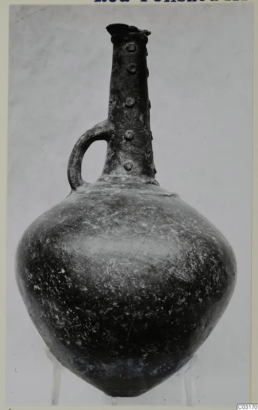 Red Polished III jug from Lapithos with a loop handle and small knobs on the neck