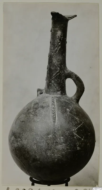Red Polished III jug from Lapithos, Vrysi tou Barba tombs, with a tall neck and single loop handle