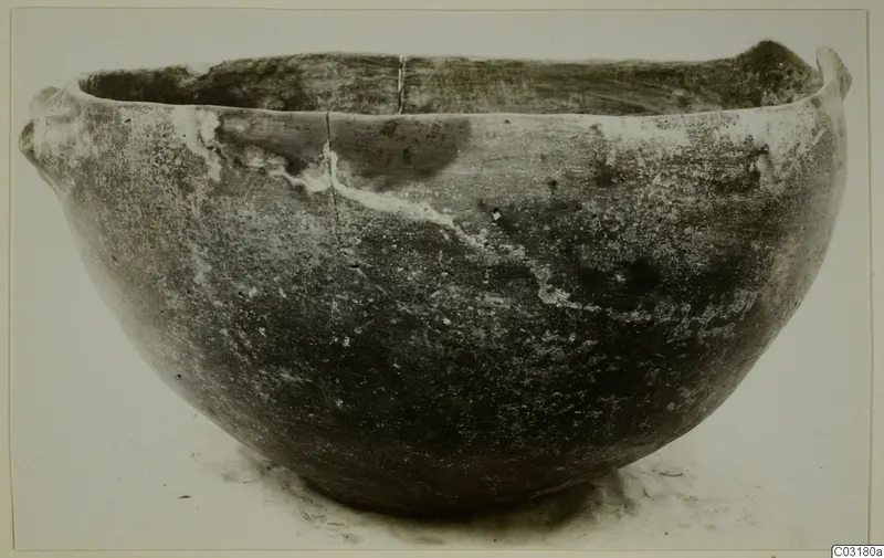 Pottery Red Polished I bowl from Lapithos, with two small lugs on the rim, seen from the side.
