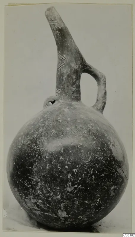 Red Polished III jug from Lapithos, Vrysi tou Barba tombs, with a long tapering neck and strap handle